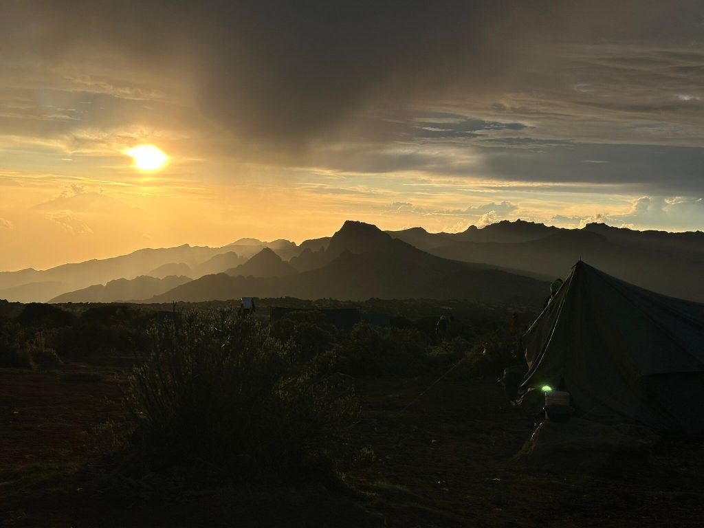Sunset over a jagged ridge seen from a camp on Mount Kilimanjaro